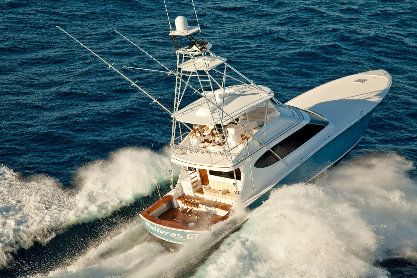 Hatteras Yachts GT70 Convertible cruising the open option in the late afternoon.