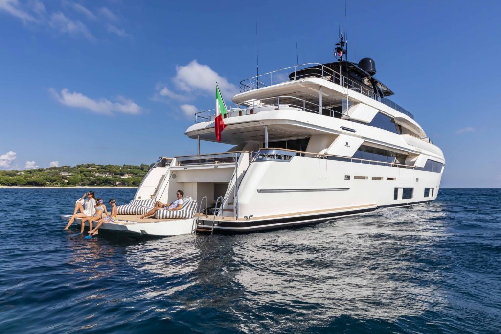Family enjoying a sunny day on a chartered superyacht.